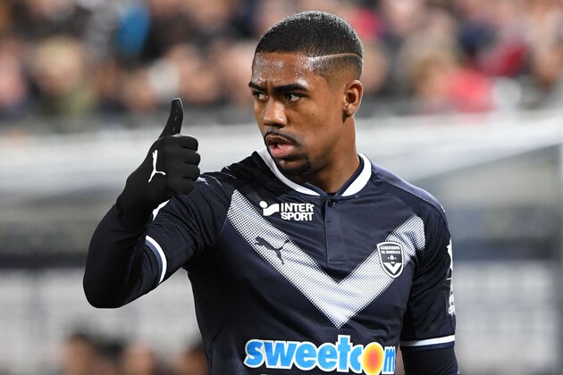 Bordeaux's Malcom gestures to teammates during the French Football League 1 match between Bordeaux and Angers at The Matmut Stadium in Bordeaux, southwestern France on March 10, 2018.  / AFP PHOTO / MEHDI FEDOUACH        (Photo credit should read MEHDI FEDOUACH/AFP/Getty Images)