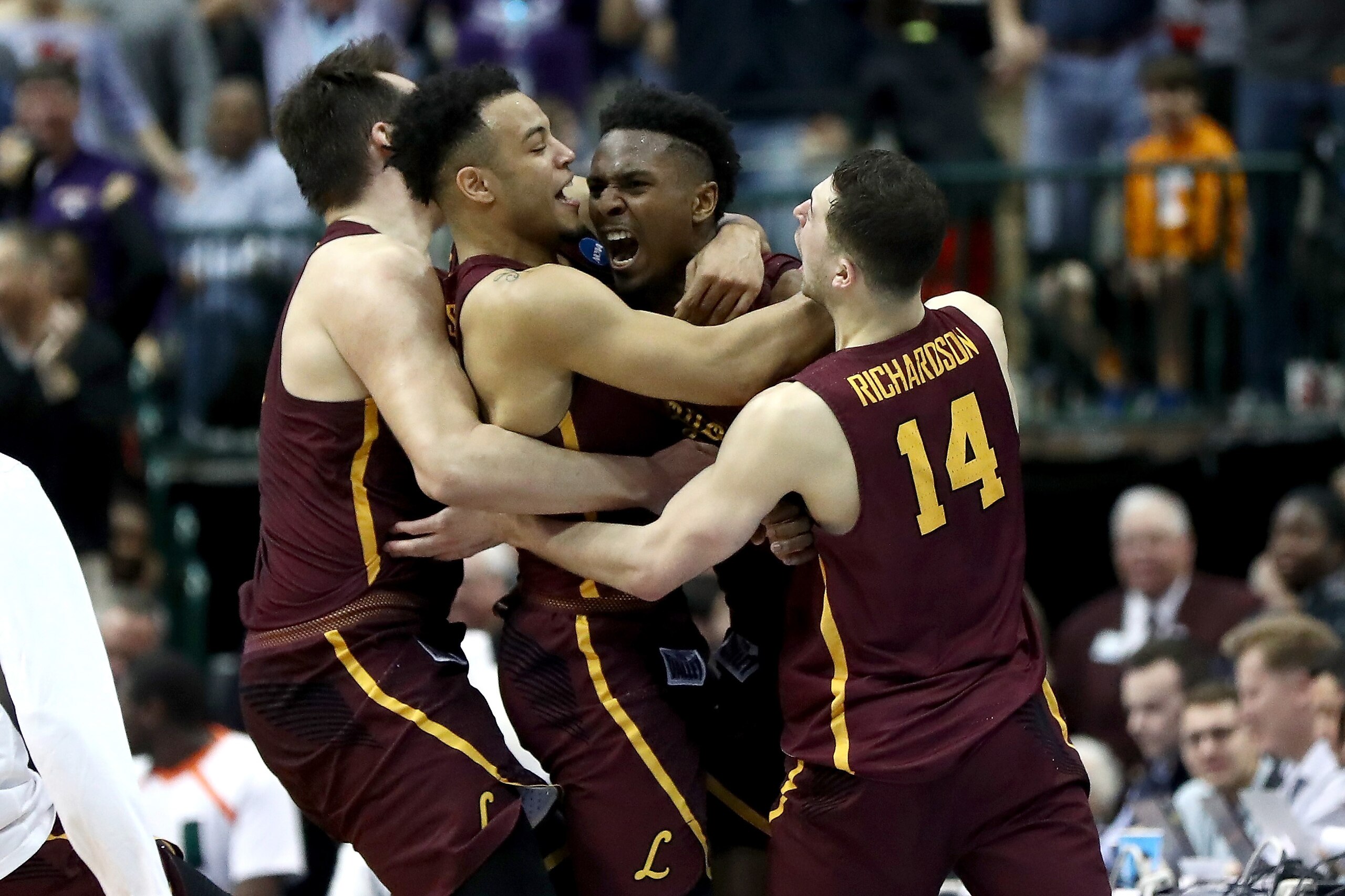 DALLAS, TX - MARCH 15:  Donte Ingram #0 and Marques Townes #5 of the Loyola Ramblers celebrate after Ingram makes a game-winning three pointer against the Miami Hurricanes in the first round of the 2018 NCAA Men's Basketball Tournament at American Airlines Center on March 15, 2018 in Dallas, Texas.  (Photo by Ronald Martinez/Getty Images)