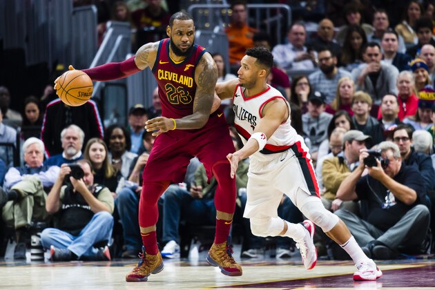 CLEVELAND, OH - JANUARY 2: LeBron James #23 of the Cleveland Cavaliers tries to drive around Evan Turner #1 of the Portland Trail Blazers during the second half at Quicken Loans Arena on January 2, 2018 in Cleveland, Ohio. The Cavaliers defeated the Trail Blazers 127-110. NOTE TO USER: User expressly acknowledges and agrees that, by downloading and or using this photograph, User is consenting to the terms and conditions of the Getty Images License Agreement. (Photo by Jason Miller/Getty Images)