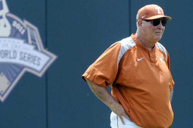 FILE - In this June 17, 2011, file photo, Texas' coach Augie Garrido surveys the playing field during NCAA college baseball practice at TD Ameritrade Park in Omaha, Neb. Garrido, who won three national baseball championships at Cal State Fullerton and two more at Texas, has died, the University of Texas announced Thursday, March 15, 2018. He was 79. (AP Photo/Dave Weaver, File)