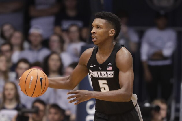 Providence forward Rodney Bullock (5) brings the ball up court against Butler in the second half of an NCAA college basketball game in Indianapolis, Saturday, Feb. 17, 2018. Butler defeated Providence 69-54. (AP Photo/Michael Conroy)