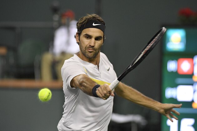 Roger Federer, of Switzerland, returns a shot against Chung Hyeon, of South Korea, during the quarterfinals at the BNP Paribas Open tennis tournament, Thursday, March 15, 2018, in Indian Wells, Calif. (AP Photo/Mark J. Terrill)