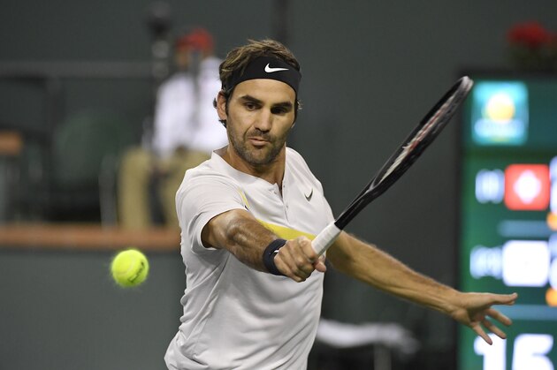 Roger Federer, of Switzerland, returns a shot against Chung Hyeon, of South Korea, during the quarterfinals at the BNP Paribas Open tennis tournament, Thursday, March 15, 2018, in Indian Wells, Calif. (AP Photo/Mark J. Terrill)