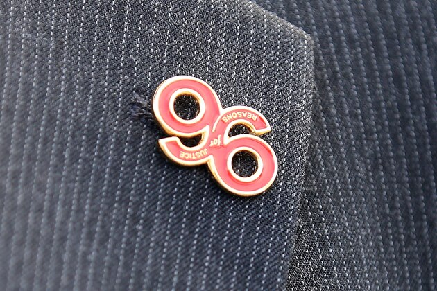 WARRINGTON, ENGLAND - APRIL 26:  A relative arrives, wearing a 'Justice for the 96' button badge, at Birchwood Park to hear the verdict of the Hillsborough inquest on April 26, 2016 in Warrington, England. The fresh inquests into the 1989 Hillsborough disaster, in which 96 football supporters were crushed to death, began on March 31 2014 after the initial verdicts were quashed. Relatives of Liverpool supporters who died in Britain's worst sporting disaster gathered in the purpose-built court to hear the jury's verdict in Warrington after a 25 year fight to overturn the accidental death verdicts handed down at the initial 1991 inquiry.  (Photo by Christopher Furlong/Getty Images)