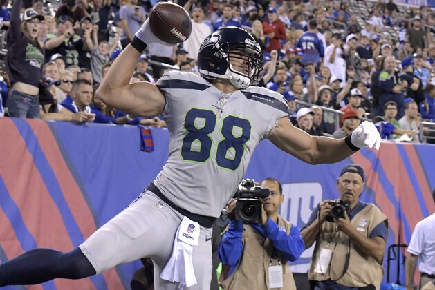 Seattle Seahawks' Jimmy Graham spikes the ball after scoring a touchdown during the second half of an NFL football game against the New York Giants, Sunday, Oct. 22, 2017, in East Rutherford, N.J. (AP Photo/Bill Kostroun)