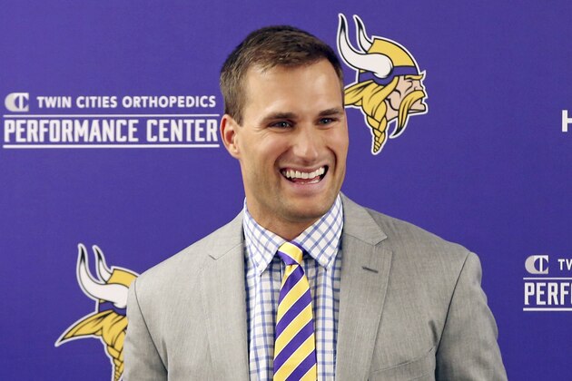 Minnesota Vikings new quarterback Kirk Cousins addresses the media after he was introduced during a news conference, after signing a three-year, $84 million contract, at the NFL football team's new headquarters Thursday, March 15, 2018, in Eagan, Minn. (AP Photo/Jim Mone)