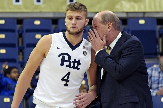 FILE - In this Nov. 14, 2016, file photo, Pittsburgh head coach Kevin Stallings, right, talks to forward Ryan Luther (4), during the first half of an NCAA college basketball game against Gardner-Webb, in Pittsburgh. Pittsburgh enters its second season under Stallings with a completely retooled roster, with Luther being one of only two scholarship team members returning from last season. The other being Jonathan Milligan. The new-look Panthers have been picked to finish last in the ACC. (AP Photo/Fred Vuich, FILE)