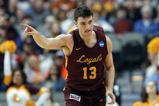 Loyola-Chicago guard Clayton Custer (13) celebrates after sinking a basket against Miami in the second half of a first-round game at the NCAA college basketball tournament in Dallas, Thursday, March 15, 2018. (AP Photo/Tony Gutierrez)
