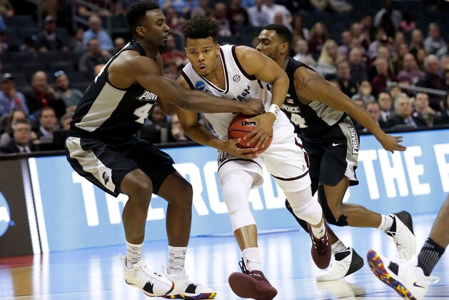 CHARLOTTE, NC - MARCH 16:  Admon Gilder #3 of the Texas A&M Aggies drives the ball against Isaiah Jackson #44 of the Providence Friars during the first round of the 2018 NCAA Men's Basketball Tournament at Spectrum Center on March 16, 2018 in Charlotte, North Carolina.  (Photo by Streeter Lecka/Getty Images)