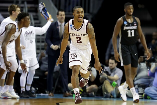 CHARLOTTE, NC - MARCH 16:  TJ Starks #2 of the Texas A&M Aggies reacts after a three point shot against the Providence Friars during the first round of the 2018 NCAA Men's Basketball Tournament at Spectrum Center on March 16, 2018 in Charlotte, North Carolina.  (Photo by Streeter Lecka/Getty Images)