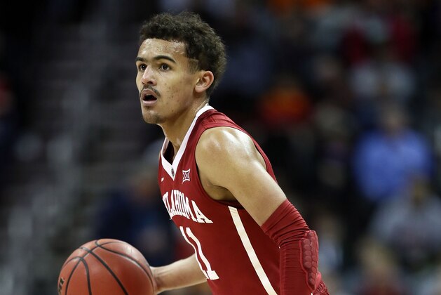 KANSAS CITY, MO - MARCH 07:  Trae Young #11 of the Oklahoma Sooners controls the ball during the first round of the Big 12 Basketball Tournament against the Oklahoma State Cowboys at the Sprint Center on March 7, 2018 in Kansas City, Missouri.  (Photo by Jamie Squire/Getty Images)
