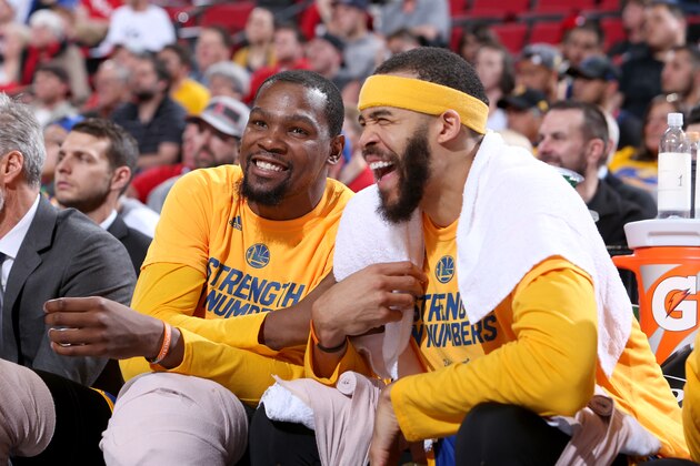PORTLAND, OR - APRIL 24:  Kevin Durant #35 and JaVale McGee #1 of the Golden State Warriors smiles during the game against the Portland Trail Blazers during Game Four of the Western Conference Quarterfinals of the 2017 NBA Playoffs on April 24, 2017 at the Moda Center in Portland, Oregon. NOTE TO USER: User expressly acknowledges and agrees that, by downloading and or using this Photograph, user is consenting to the terms and conditions of the Getty Images License Agreement. Mandatory Copyright Notice: Copyright 2017 NBAE (Photo by Sam Forencich/NBAE via Getty Images)