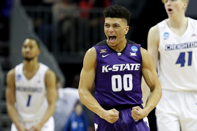 CHARLOTTE, NC - MARCH 16:  Mike McGuirl #00 of the Kansas State Wildcats reacts against the Creighton Bluejays during the first round of the 2018 NCAA Men's Basketball Tournament at Spectrum Center on March 16, 2018 in Charlotte, North Carolina.  (Photo by Streeter Lecka/Getty Images)