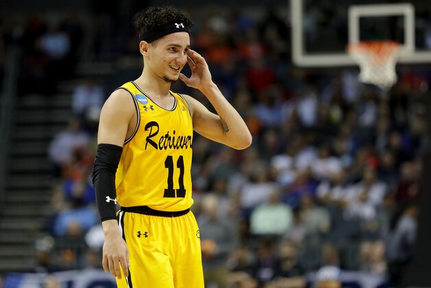 CHARLOTTE, NC - MARCH 16:  K.J. Maura #11 of the UMBC Retrievers looks on against the Virginia Cavaliers during the first round of the 2018 NCAA Men's Basketball Tournament at Spectrum Center on March 16, 2018 in Charlotte, North Carolina.  (Photo by Streeter Lecka/Getty Images)