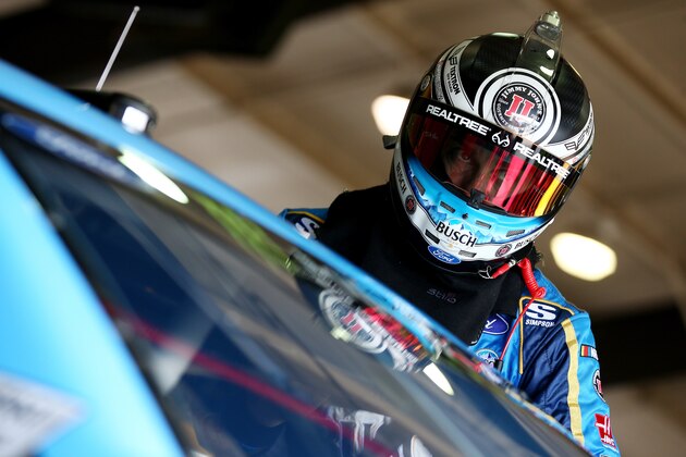 FONTANA, CA - MARCH 16:  Kevin Harvick, driver of the #4 Busch Beer Ford, climbs into his car during practice for the Monster Energy NASCAR Cup Series Auto Club 400 at Auto Club Speedway on March 16, 2018 in Fontana, California.  (Photo by Sarah Crabill/Getty Images)