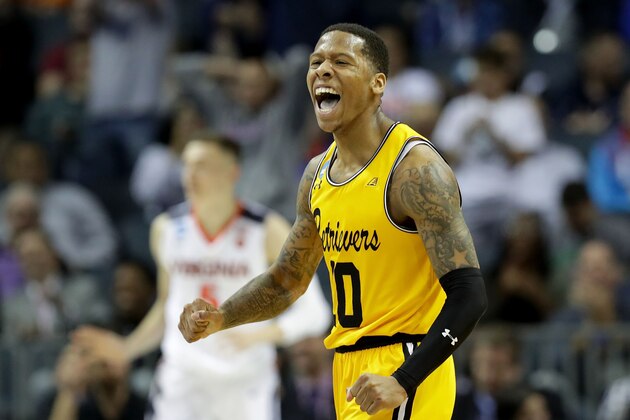 CHARLOTTE, NC - MARCH 16:  Jairus Lyles #10 of the UMBC Retrievers reacts after a score against the Virginia Cavaliers during the first round of the 2018 NCAA Men's Basketball Tournament at Spectrum Center on March 16, 2018 in Charlotte, North Carolina.  (Photo by Streeter Lecka/Getty Images)