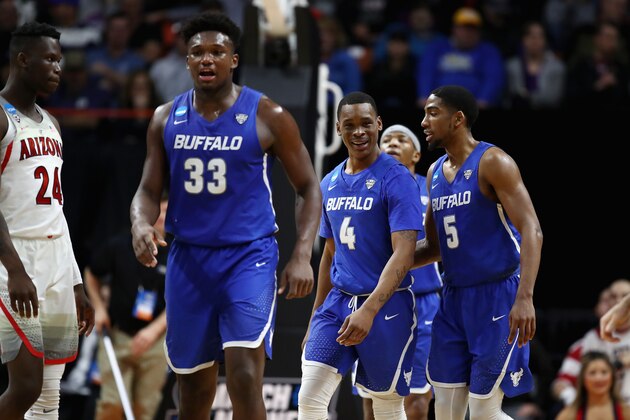 BOISE, ID - MARCH 15:  Nick Perkins #33, Davonta Jordan #4 and CJ Massinburg #5 of the Buffalo Bulls react in the second half against the Arizona Wildcats during the first round of the 2018 NCAA Men's Basketball Tournament at Taco Bell Arena on March 15, 2018 in Boise, Idaho.  (Photo by Ezra Shaw/Getty Images)