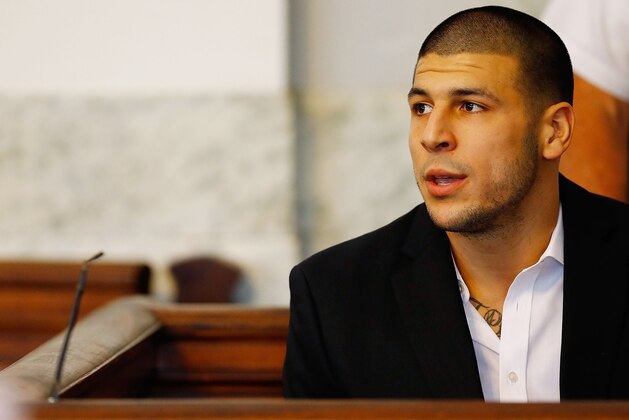 NORTH ATTLEBORO, MA - AUGUST 22: Aaron Hernandez sits in the courtroom of the Attleboro District Court during his hearing on August 22, 2013 in North Attleboro, Massachusetts. Former New England Patriot Aaron Hernandez has been indicted on a first-degree murder charge for the death of Odin Lloyd. (Photo by Jared Wickerham/Getty Images)