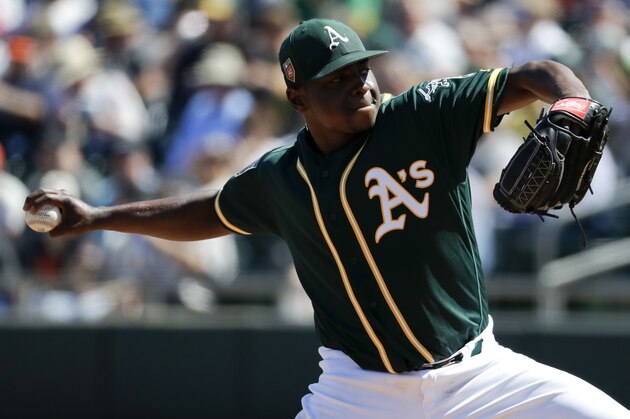 Oakland Athletics starting pitcher Jharel Cotton throws against the San Francisco Giants during the first inning of a spring baseball game in Mesa, Ariz., Monday, March 12, 2018. (AP Photo/Chris Carlson)