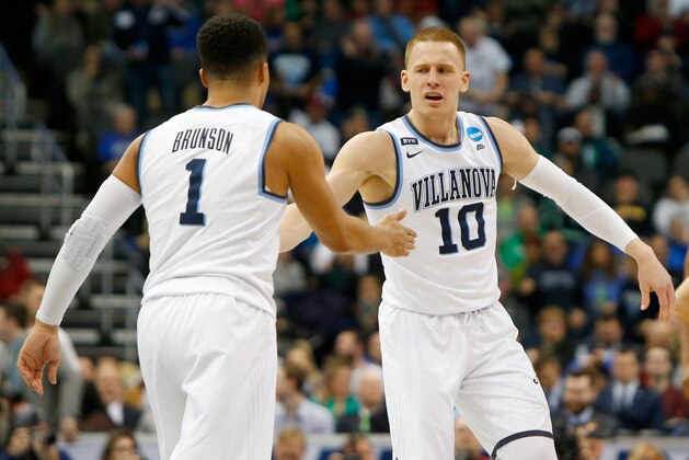 PITTSBURGH, PA - MARCH 17:  Donte DiVincenzo #10 of the Villanova Wildcats celebrates with his teammate Jalen Brunson #1 against the Alabama Crimson Tide during the second half in the second round of the 2018 NCAA Men's Basketball Tournament at PPG PAINTS Arena on March 17, 2018 in Pittsburgh, Pennsylvania.  (Photo by Justin K. Aller/Getty Images)