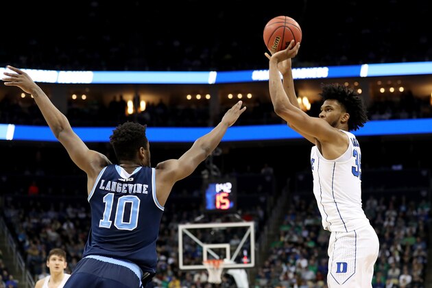 PITTSBURGH, PA - MARCH 17:  Marvin Bagley III #35 of the Duke Blue Devils shoots the ball against Cyril Langevine #10 of the Rhode Island Rams during the first half in the second round of the 2018 NCAA Men's Basketball Tournament at PPG PAINTS Arena on March 17, 2018 in Pittsburgh, Pennsylvania.  (Photo by Rob Carr/Getty Images)