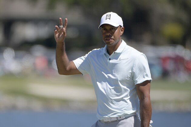 Tiger Woods acknowledges the gallery after making a putt for birdie on the sixth green during the third round of the Arnold Palmer Invitational golf tournament Saturday, March 17, 2018, in Orlando, Fla. (AP Photo/Phelan M. Ebenhack)