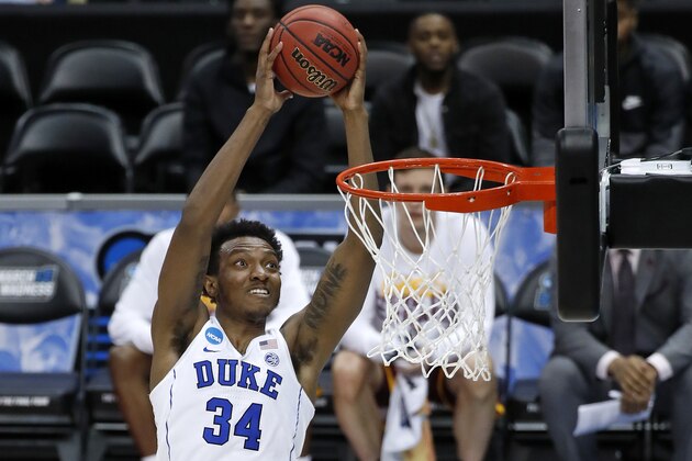 Duke's Wendell Carter Jr dunks the basketball during the first half of an NCAA men's college basketball tournament first-round game against Iona, in Pittsburgh, Thursday, March 15, 2018. (AP Photo/Gene J. Puskar)