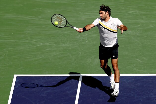 INDIAN WELLS, CA - MARCH 17:  Roger Federer of Switzerland returns a shot to Borna Coric of Croatia during the semifinals of the BNP Paribas Open at the Indian Wells Tennis Garden on March 17, 2018 in Indian Wells, California.  (Photo by Matthew Stockman/Getty Images)