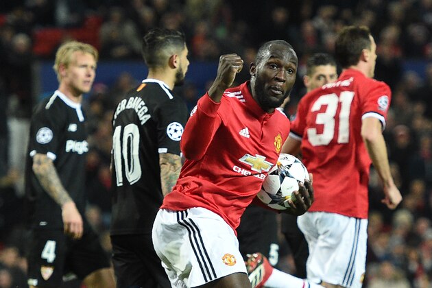 Manchester United's Belgian striker Romelu Lukaku celebrates after scoring during a last 16 second leg UEFA Champions League football match between Manchester United and Sevilla at Old Trafford in Manchester, northwest England on March 13, 2018. / AFP PHOTO / Oli SCARFF        (Photo credit should read OLI SCARFF/AFP/Getty Images)