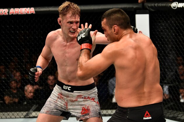 LONDON, ENGLAND - MARCH 17:  (L-R) Alexander Volkov of Russia punches Fabricio Werdum of Brazil in their heavyweight bout inside The O2 Arena on March 17, 2018 in London, England. (Photo by Brandon Magnus/Zuffa LLC/Zuffa LLC via Getty Images)