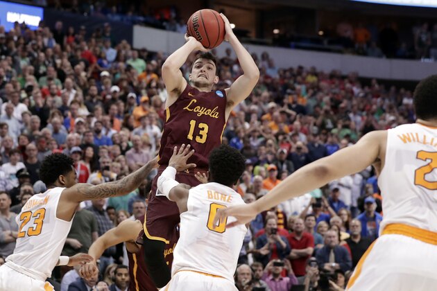 Loyola-Chicago guard Clayton Custer (13) shoots over Tennessee's Jordan Bowden (23) and Jordan Bone (0) and scores in the final seconds of a second-round game at the NCAA men's college basketball tournament in Dallas, Saturday, March 17, 2018. The shot helped Loyola to a 63-62 win. (AP Photo/Tony Gutierrez)