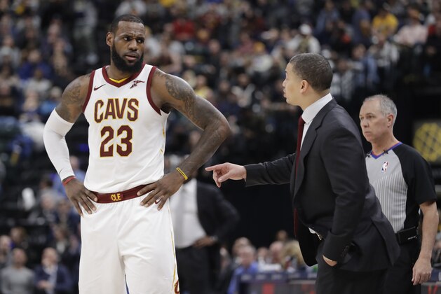 Cleveland Cavaliers head coach Tyronn Lue talks with LeBron James during the second half of an NBA basketball game against the Indiana Pacers, Friday, Jan. 12, 2018, in Indianapolis. Indiana won 97-95. (AP Photo/Darron Cummings)