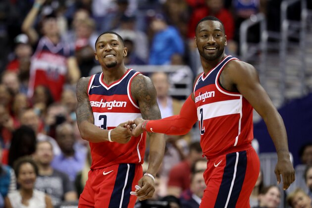 WASHINGTON, DC - OCTOBER 20: Bradley Beal #3 and John Wall #2 of the Washington Wizards celebrate in the second half against the Detroit Pistons at Capital One Arena on October 20, 2017 in Washington, DC. NOTE TO USER: User expressly acknowledges and agrees that, by downloading and or using this photograph, User is consenting to the terms and conditions of the Getty Images License Agreement. (Photo by Rob Carr/Getty Images)