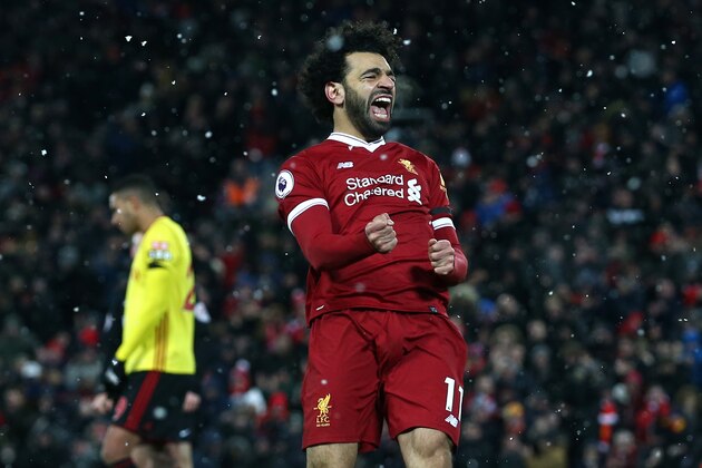 LIVERPOOL, ENGLAND - MARCH 17:  Mohamed Salah of Liverpool celebrates scoring his side's fourth goal during the Premier League match between Liverpool and Watford at Anfield on March 17, 2018 in Liverpool, England.  (Photo by Jan Kruger/Getty Images)