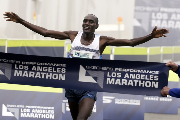 Weldon Kirui celebrates as he wins the Los Angeles Marathon, Sunday, Feb. 14, 2016, in Santa Monica, Calif. (AP Photo/Chris Carlson)