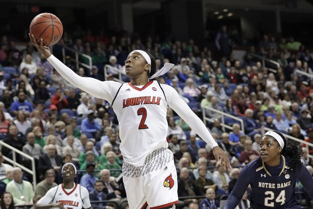 Louisville's Myisha Hines-Allen (2) drives past Notre Dame's Arike Ogunbowale (24) during the first half of an NCAA college basketball game in the championship of the women's Atlantic Coast Conference tournament in Greensboro, N.C., Sunday, March 4, 2018. (AP Photo/Chuck Burton)