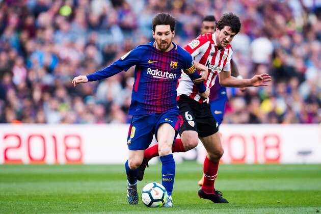 BARCELONA, SPAIN - MARCH 18:  Lionel Messi of FC Barcelona runs with the ball under pressure from Mikel San Jose of Athletic Club during the La Liga match between Barcelona and Athletic Club at Camp Nou on March 18, 2018 in Barcelona, Spain.  (Photo by Alex Caparros/Getty Images)