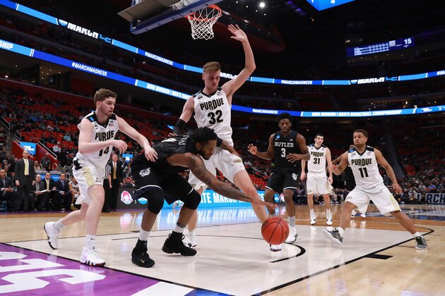 DETROIT, MI - MARCH 18:  Tyler Wideman #4 of the Butler Bulldogs rebounds the ball against Ryan Cline #14 and Matt Haarms #32 of the Purdue Boilermakers during the first half in the second round of the 2018 NCAA Men's Basketball Tournament at Little Caesars Arena on March 18, 2018 in Detroit, Michigan.  (Photo by Elsa/Getty Images)