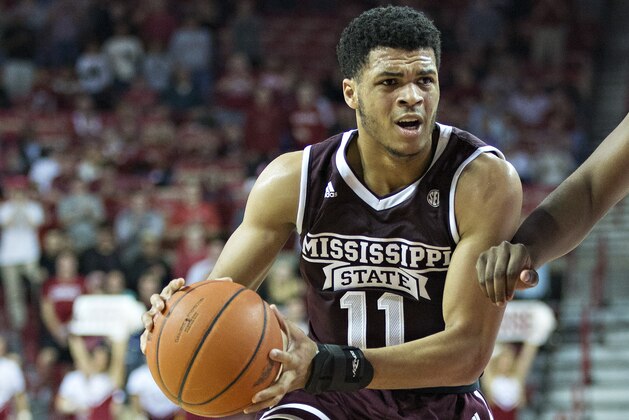FAYETTEVILLE, AR - JANUARY 10:  Quinndary Weatherspoon #11 of the Mississippi State Bulldogs drives to the basket against Trey Thompson #1 of the Arkansas Razorbacks at Bud Walton Arena on January 10, 2017 in Fayetteville, Arkansas.  The Bulldogs defeated the Razorbacks 84-78.  (Photo by Wesley Hitt/Getty Images)