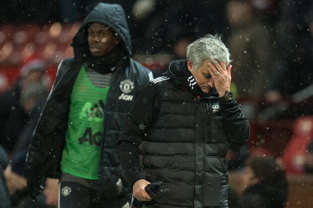 Manchester United's Portuguese manager Jose Mourinho (R) and French midfielder Paul Pogba leave after the English FA Cup quarter-final football match between Manchester United and Brighton and Hove Albion at Old Trafford in Manchester, north west England, on March 17, 2018. / AFP PHOTO / Oli SCARFF / RESTRICTED TO EDITORIAL USE. No use with unauthorized audio, video, data, fixture lists, club/league logos or 'live' services. Online in-match use limited to 75 images, no video emulation. No use in betting, games or single club/league/player publications.  /         (Photo credit should read OLI SCARFF/AFP/Getty Images)