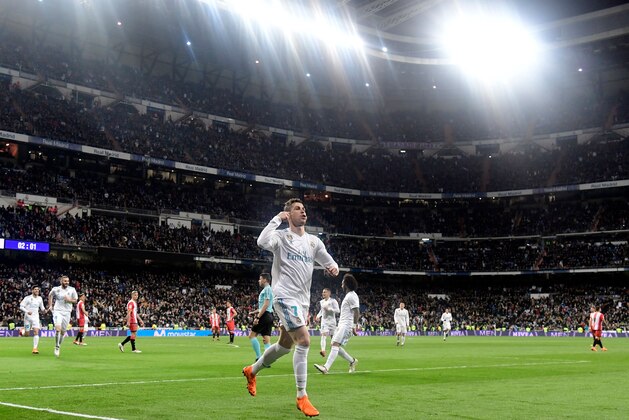 Real Madrid's Portuguese forward Cristiano Ronaldo celebrates a goal during the Spanish League football match between Real Madrid CF and Girona FC at the Santiago Bernabeu stadium in Madrid on March 18, 2018. / AFP PHOTO / JAVIER SORIANO        (Photo credit should read JAVIER SORIANO/AFP/Getty Images)