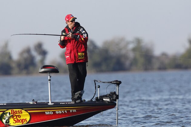 Current leader Kevin VanDam, of Kalamazoo, Mich., competes in the Bassmaster Classic during the final round in Lake Cataouatche in Jefferson Parish, La., Sunday, Feb. 20, 2011. (AP Photo/Gerald Herbert)