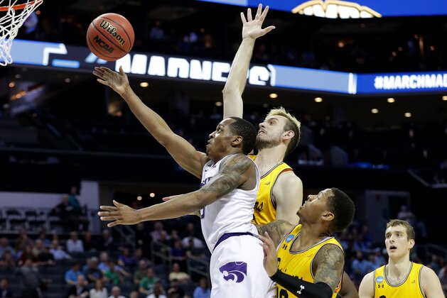 CHARLOTTE, NC - MARCH 18:  Barry Brown #5 of the Kansas State Wildcats lays up a shot against the UMBC Retrievers during the second round of the 2018 NCAA Men's Basketball Tournament at Spectrum Center on March 18, 2018 in Charlotte, North Carolina.  (Photo by Streeter Lecka/Getty Images)