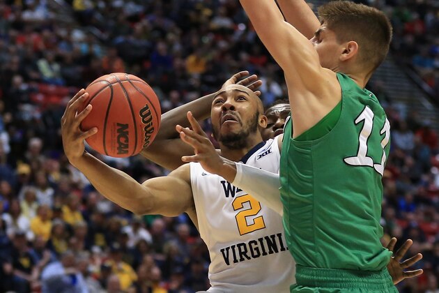 SAN DIEGO, CA - MARCH 18: Jevon Carter #2 of the West Virginia Mountaineers shoots against Ajdin Penava #11 of the Marshall Thundering Herd in the first half during the second round of the 2018 NCAA Men's Basketball Tournament at Viejas Arena on March 18, 2018 in San Diego, California.  (Photo by Sean M. Haffey/Getty Images)