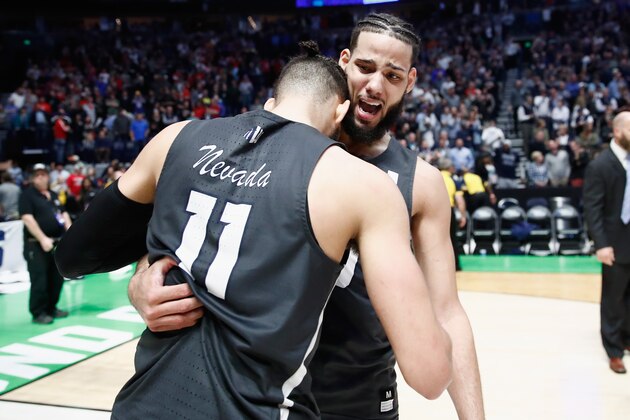 NASHVILLE, TN - MARCH 18:  Caleb Martin #10 celebrates with Cody Martin #11 of the Nevada Wolf Pack after defeating the Cincinnati Bearcats in the second round of the 2018 Men's NCAA Basketball Tournament at Bridgestone Arena on March 18, 2018 in Nashville, Tennessee.  (Photo by Andy Lyons/Getty Images)