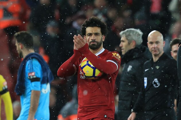 Liverpool's Egyptian midfielder Mohamed Salah gestures after  the English Premier League football match between Liverpool and Watford at Anfield in Liverpool, north west England on March 17, 2018. / AFP PHOTO / Lindsey PARNABY / RESTRICTED TO EDITORIAL USE. No use with unauthorized audio, video, data, fixture lists, club/league logos or 'live' services. Online in-match use limited to 75 images, no video emulation. No use in betting, games or single club/league/player publications.  /         (Photo credit should read LINDSEY PARNABY/AFP/Getty Images)