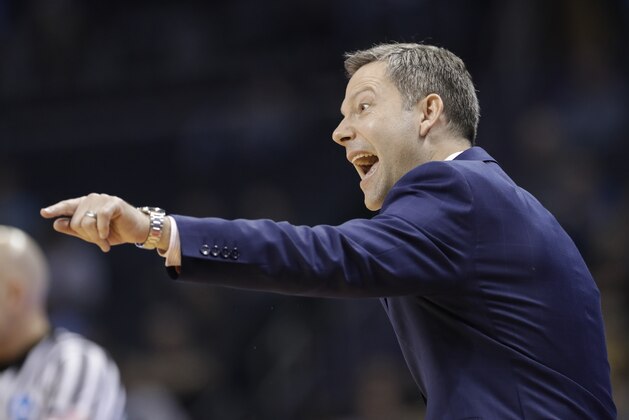 UMBC coach Ryan Odom directs his team against Kansas State during the second half of a second-round game in the NCAA men's college basketball tournament in Charlotte, N.C., Sunday, March 18, 2018. (AP Photo/Gerry Broome)