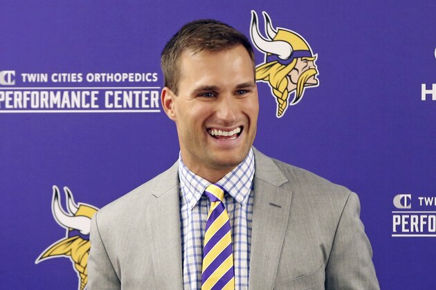Minnesota Vikings new quarterback Kirk Cousins addresses the media after he was introduced during a news conference, after signing a three-year, $84 million contract, at the NFL football team's new headquarters Thursday, March 15, 2018, in Eagan, Minn. (AP Photo/Jim Mone)