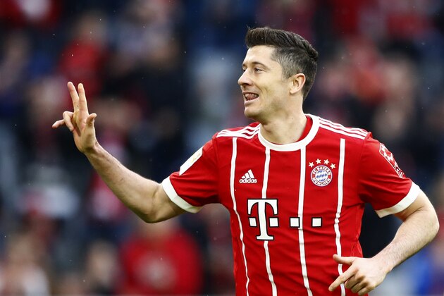 Bayern's Robert Lewandowski celebrates after scoring his side's sixth goal during the German Soccer Bundesliga match between FC Bayern Munich and Hamburger SV in Munich, Germany, Saturday, March 10, 2018. (AP Photo/Matthias Schrader)