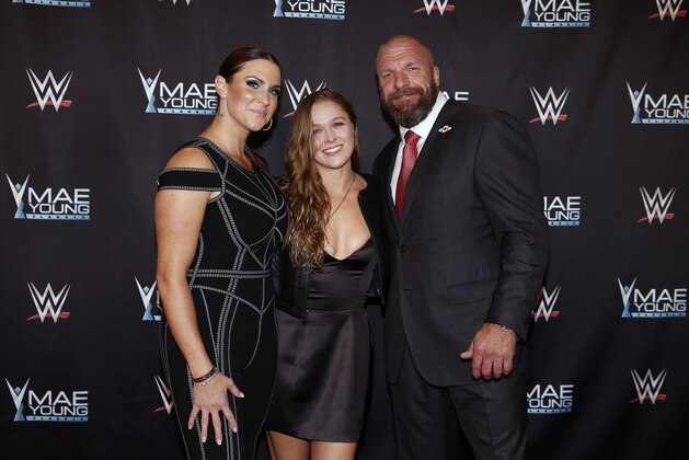 IMAGE DISTRIBUTED FOR WWE - WWE Chief Brand Officer Stephanie McMahon, left, Ronda Rousey, center, and WWE EVP of Talent, Live Events and Creative Paul
